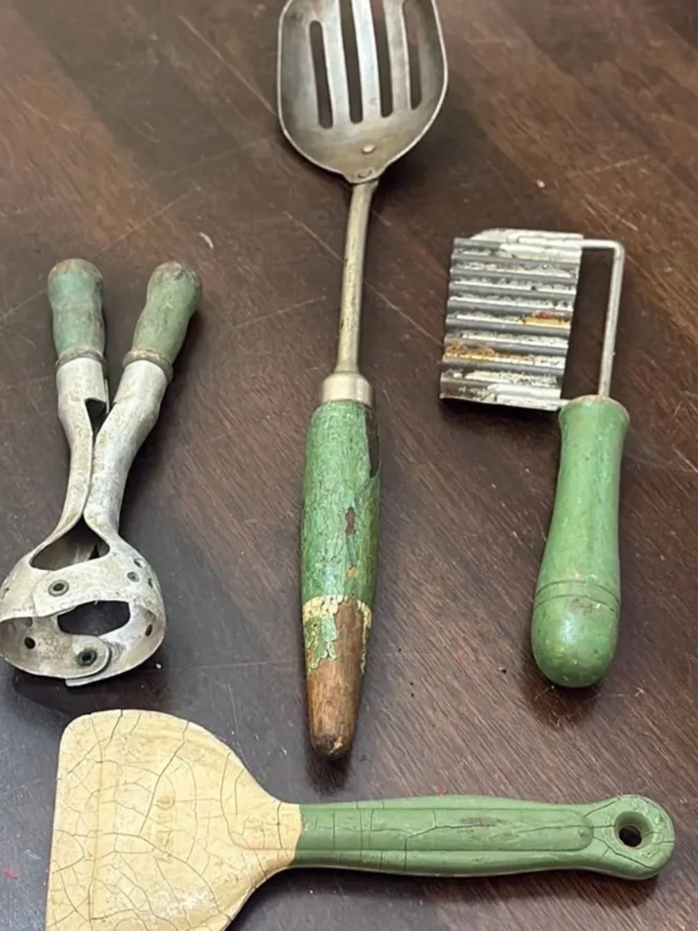 Set of chippy green handle utensils